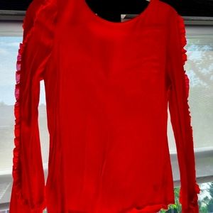 MEDIUM lightweight Red blouse with ruffle arm detail and peep hole back